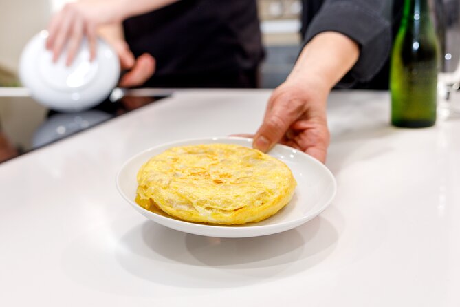 Authentic Tapas Cooking Class at a Private Local Eatery in Madrid - What you cook: four Spanish dishes with a tapas-and-paella focus