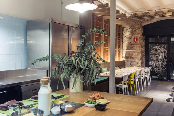 Barcelona Culinary Experience: Paella & Tapas Cooking Class - Wine, conversation, and why the group cap matters
