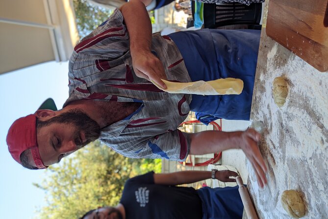 Chania Cooking Class-The Authentic Enjoy traditional Cretan meal - Kalitsounia with rolling pins: savory pies first, sweet pies at dessert