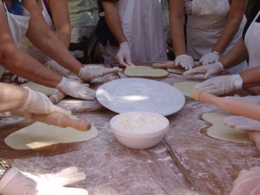 Heraklion: Cretan Cooking Lesson with Lunch in Arolithos - Lunch on the terrace: views of vineyards, valley, Heraklion, and Giouchtas