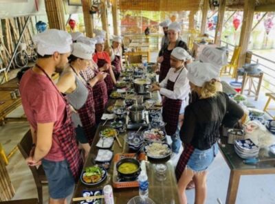 Hoi An: Vegetarian Cooking Class w Local Family and transfer - Inside the coconut village kitchen with an English-speaking chef
