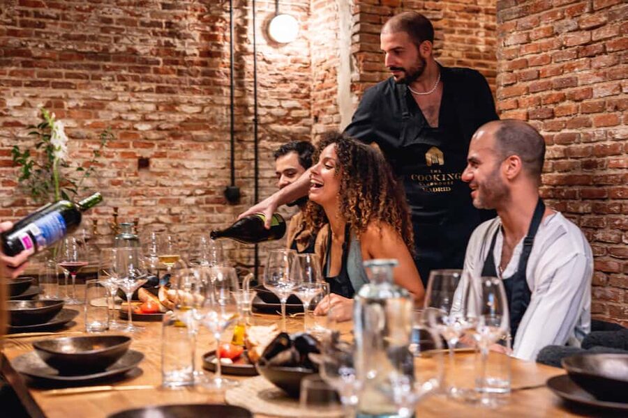 Madrid: Tapas Cooking Class with bottomless Wine Pairing - The 120-Year-Old Wine Cellar: Communal Table Time