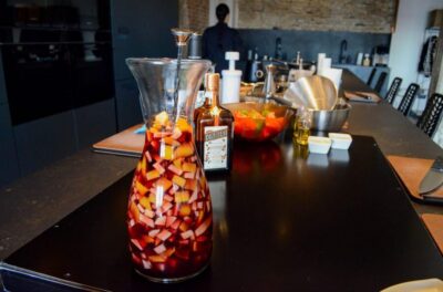 Málaga: Paella and Sangria Cooking Class with Market Visit - The Soho kitchen setup: olive oil tasting plus clean, modern prep