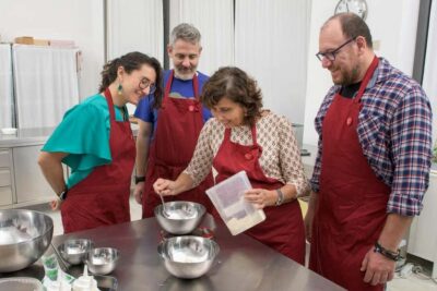 only in ITALIAN - International aperitif + cooking class in Italian - A friendly professional kitchen, plus a cozy dining room before you cook