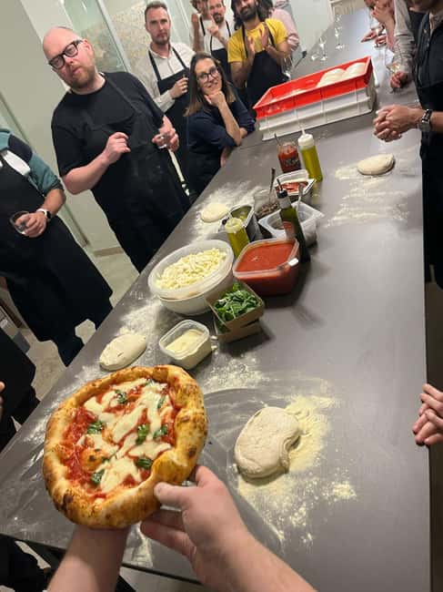 Pizza and Tiramisu Cooking Class with Wine in Milan - Shaping, topping, and baking your pizza to eat right there
