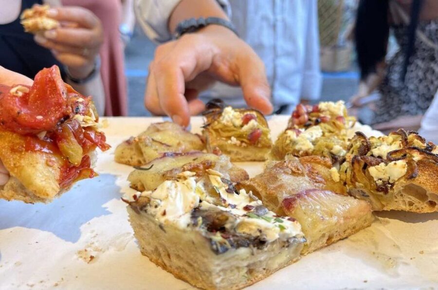 Rome: Gourmet Pizza Cooking Class (SHARED) - The oven payoff: eating what you made (with wine)