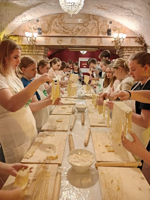 Rome: Pasta & Tiramisu Cooking Class near the Spanish Steps - Inside the Room: Historic Wall Paintings and Air-Conditioned Comfort