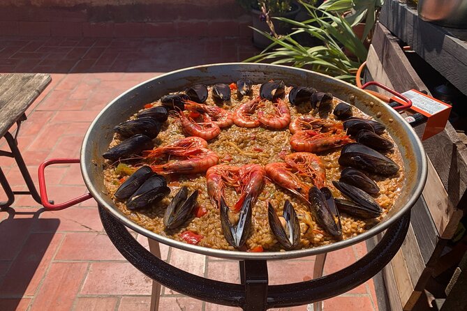 Rooftop Paella Seafood Cooking Class Experience in Barcelona - Dinner on the Terrace: Sunset, Plants, and Harbor Views
