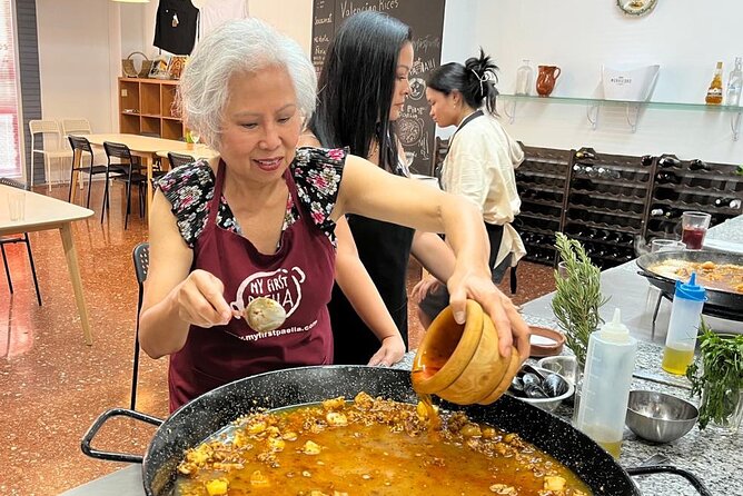 Seafood paella cooking class, tapas and visit to Ruzafa market. - The Meal After Cooking: Wines, Tomato Salad, Cake, and Mistela