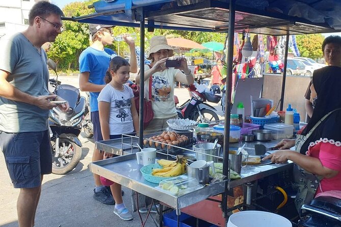 Thai Cooking Class Phuket by Tony - Back at the kitchen: your station, printed plan, and step-by-step cooking