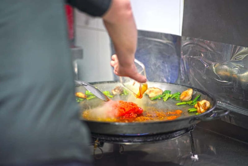 Valencia: Traditional Paella Cooking Class and Dinner - Language and group vibe: English and Spanish, with room to participate