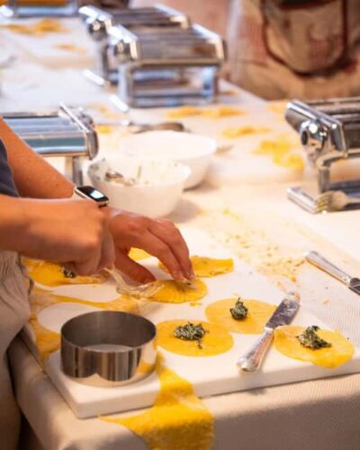 Verona Arena: The ORIGINAL Fresh Pasta and Tiramisu Cooking Class with wine - The flow inside the restaurant: Prosecco to kitchen to dinner table